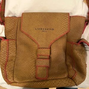 Genuine snakeskin leather. Neutral taupe color. Pink trim. Fashionable & fun